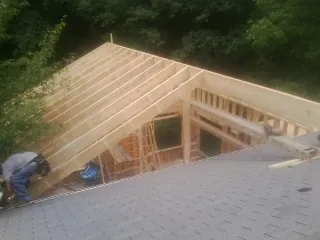 Framing a new roof addition that ties into an existing shingle roof in Wingate